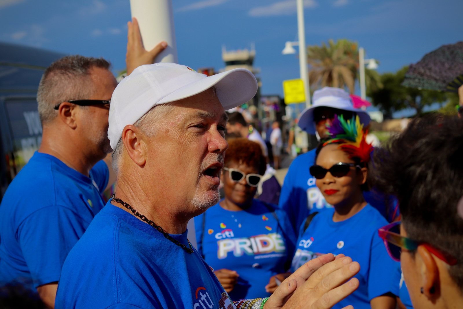 Group leader in a white cap briefing the team before the march
