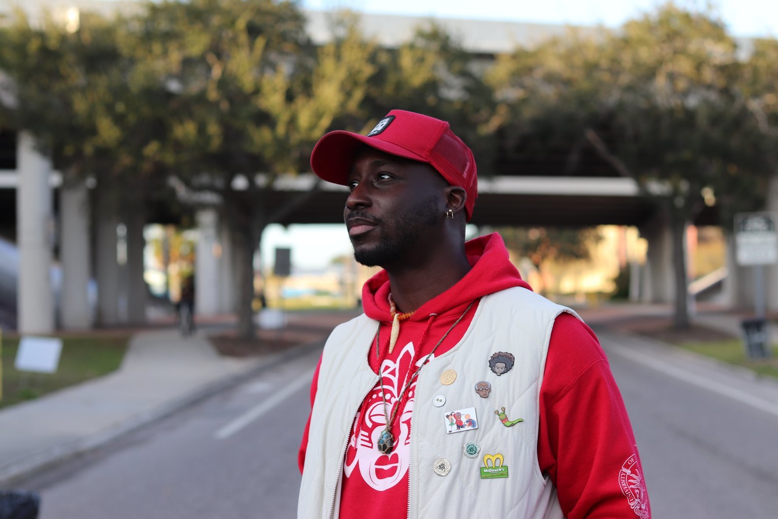 Man in a red cap and jacket outdoors